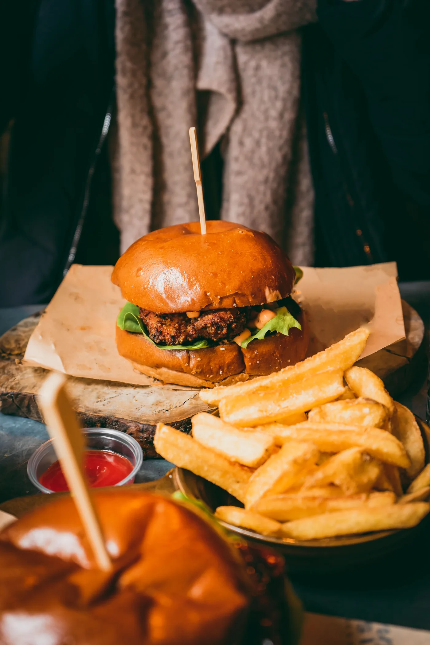Gourmet burger and fries served on a restaurant table